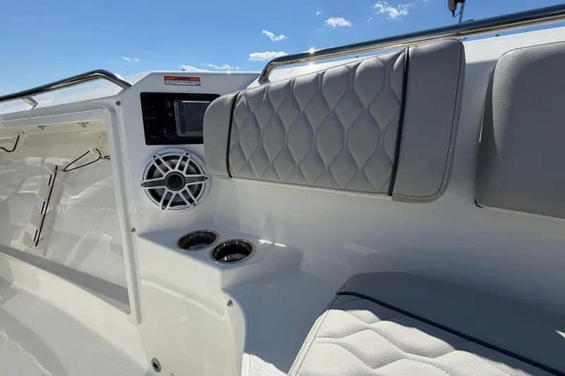 Slide: The Image of 2026 Pursuit S 358 Sport boat interior with quilted seating and speaker system. - 111