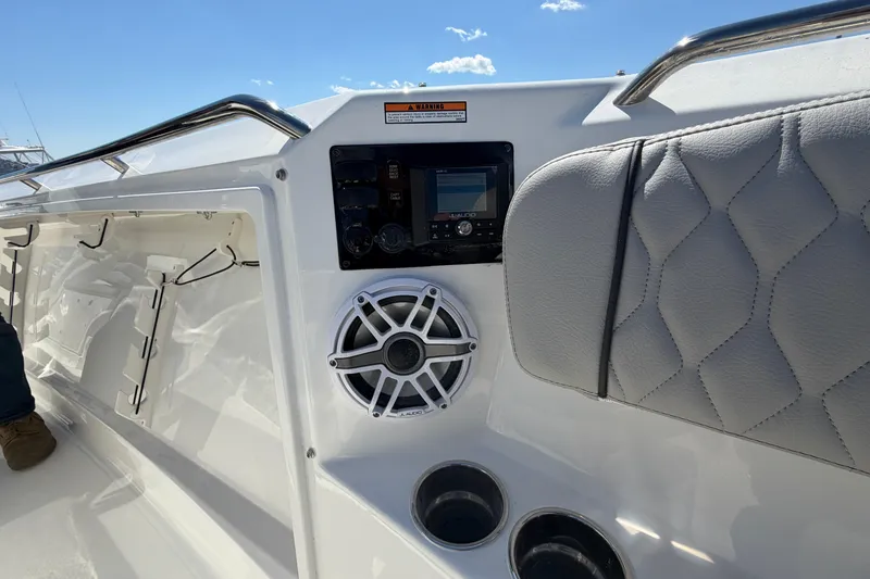 Slide: The Image of 2026 Pursuit S 358 Sport boat interior with speaker and control panel. - 112