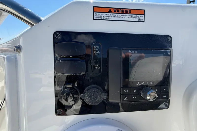 Slide: The Image of Control panel of 2026 Pursuit S 358 Sport boat featuring JL Audio system. - 113