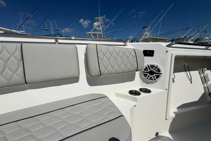 Slide: The Image of Luxurious seating on 2026 Pursuit S 358 Sport boat with cup holders and speaker. - 118