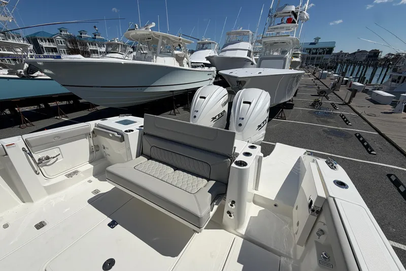 Slide: The Image of 2026 Pursuit S 358 Sport boat with dual Yamaha engines docked at marina. - 12