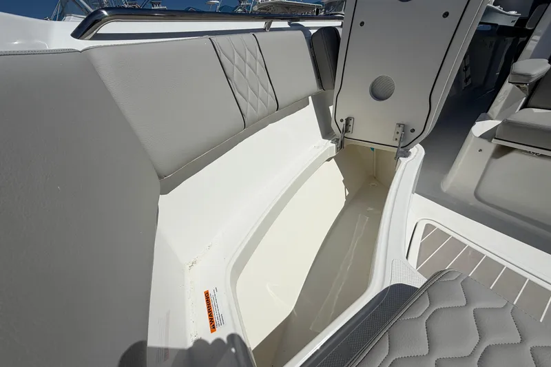 Slide: The Image of Storage compartment on 2026 Pursuit S 358 Sport boat with cushioned seating. - 121