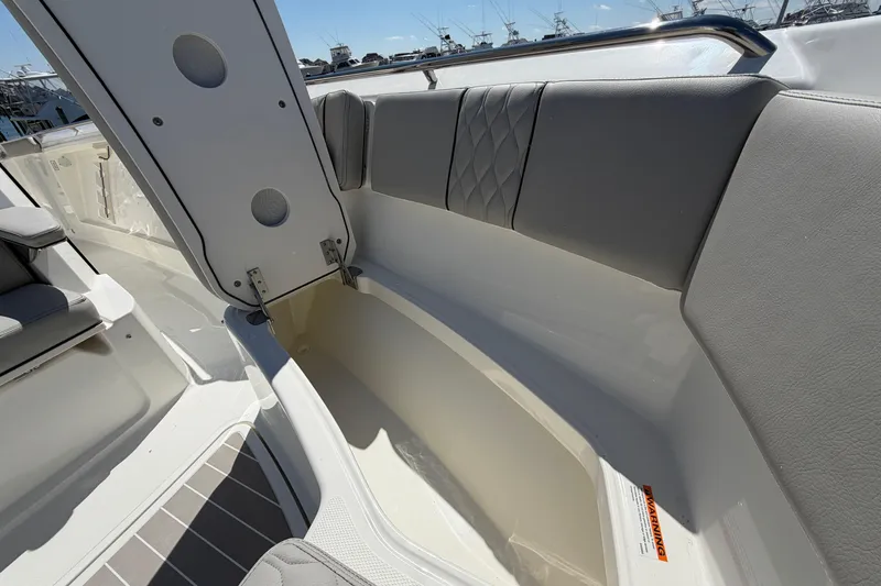 Slide: The Image of Interior view of 2026 Pursuit S 358 Sport boat, featuring sleek seating and storage. - 123