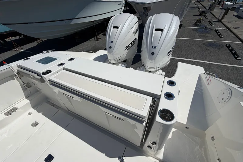 Slide: The Image of 2026 Pursuit S 358 Sport boat with dual outboard engines, sleek deck design. - 13