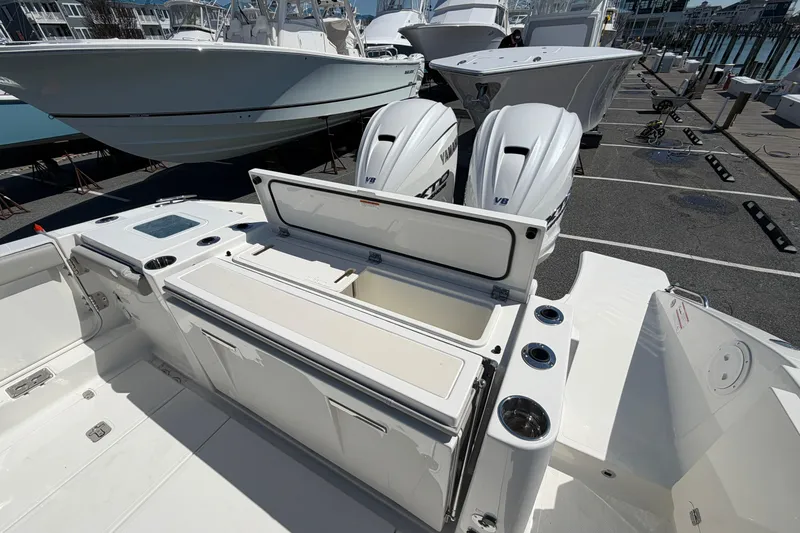Slide: The Image of 2026 Pursuit S 358 Sport boat with dual Yamaha engines at a marina. - 14