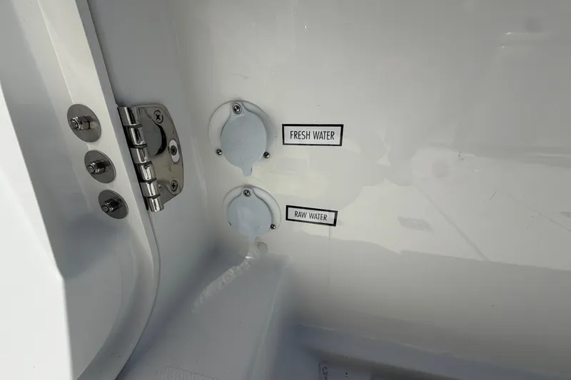 Slide: The Image of Water access points on 2026 Pursuit S 358 Sport boat, labeled fresh and raw water. - 21