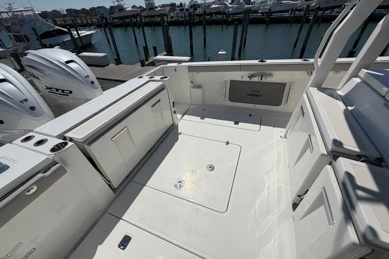 Slide: The Image of 2026 Pursuit S 358 Sport boat deck with Yamaha V8 engines at marina. - 28