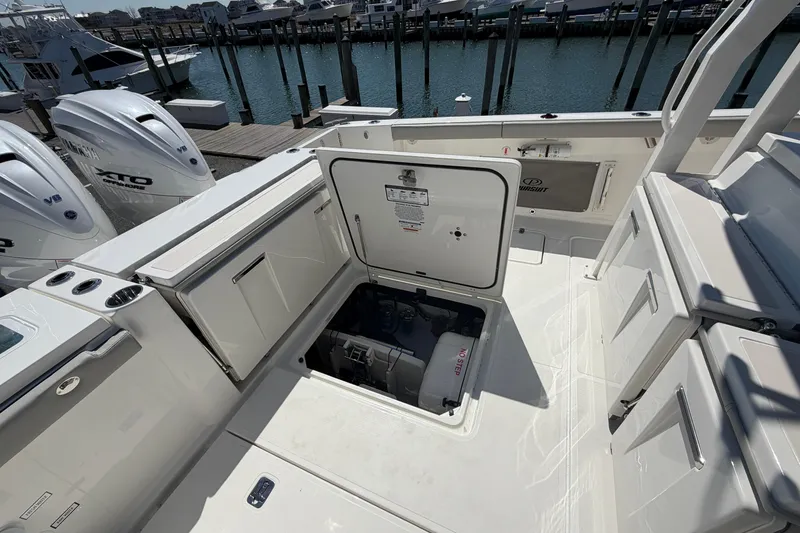 Slide: The Image of 2026 Pursuit S 358 Sport boat deck with open hatch and Yamaha engines. - 29