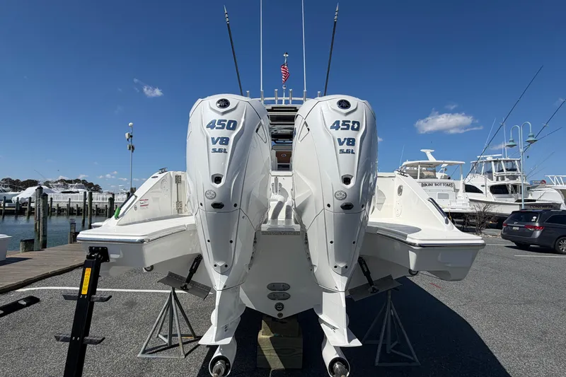 Slide: The Image of 2026 Pursuit S 358 Sport boat with twin 450 V8 engines at a marina. - 3