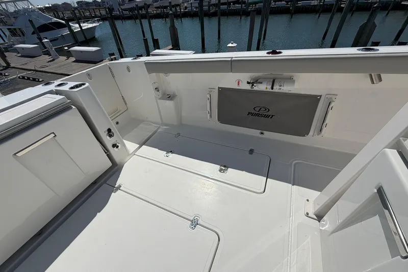 Slide: The Image of Spacious deck of 2026 Pursuit S 358 Sport boat at marina. - 34