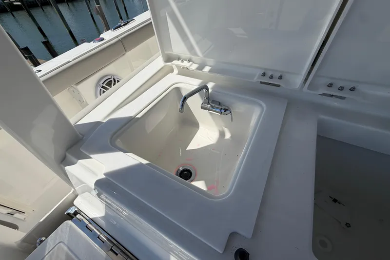 Slide: The Image of Sink area on 2026 Pursuit S 358 Sport boat, featuring a sleek faucet design. - 44