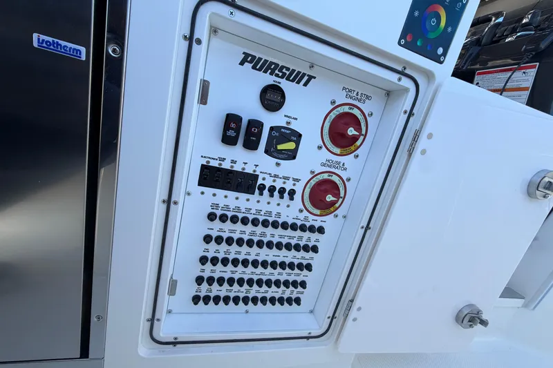 Slide: The Image of Control panel of 2026 Pursuit S 358 Sport boat with various switches and dials. - 65
