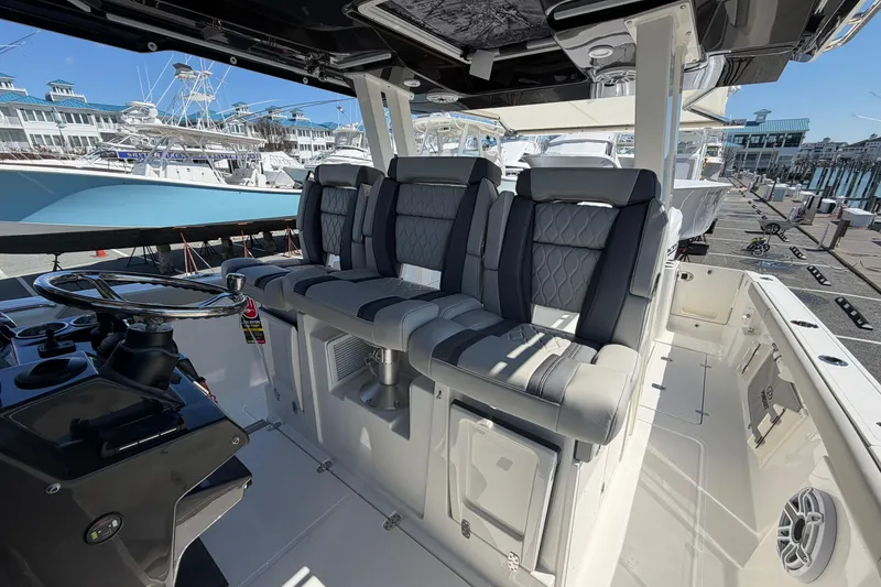 Slide: The Image of Interior view of 2026 Pursuit S 358 Sport boat with luxurious seating and helm. - 67