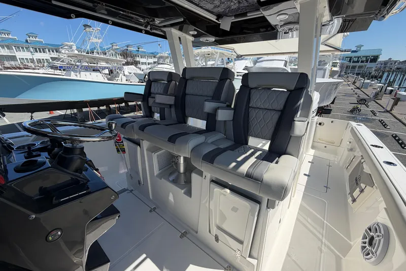 Slide: The Image of 2026 Pursuit S 358 Sport boat interior with luxurious seating and modern helm controls. - 68