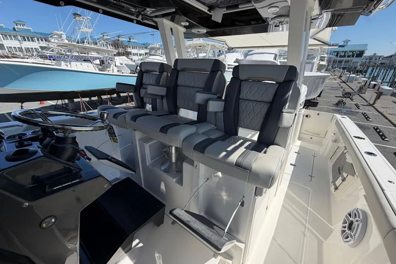Slide: The Image of 2026 Pursuit S 358 Sport boat interior with luxurious seating and modern helm controls. - 70