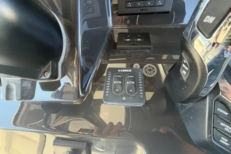 Slide: The Image of Control panel of 2026 Pursuit S 358 Sport boat with Lenco trim tab switches. - 76