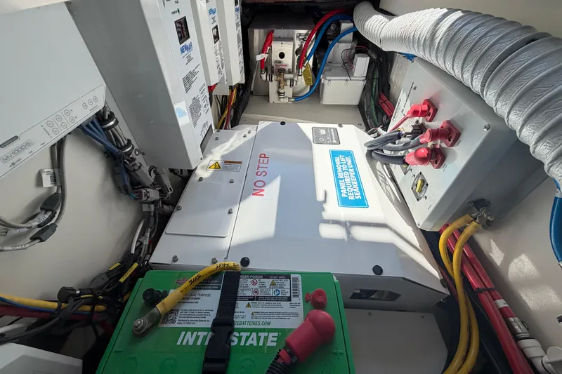 Slide: The Image of Electrical system of 2026 Pursuit S 358 Sport boat, featuring batteries and wiring. - 84