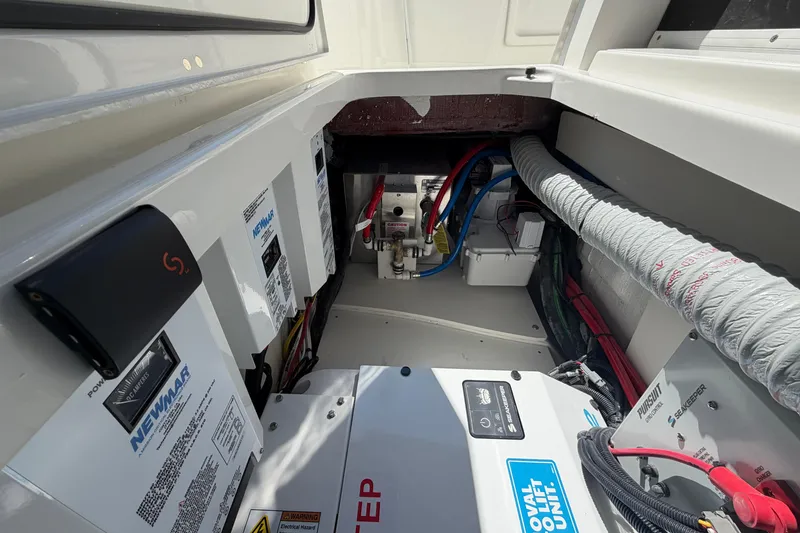 Slide: The Image of Engine compartment of 2026 Pursuit S 358 Sport boat with wiring and equipment. - 86