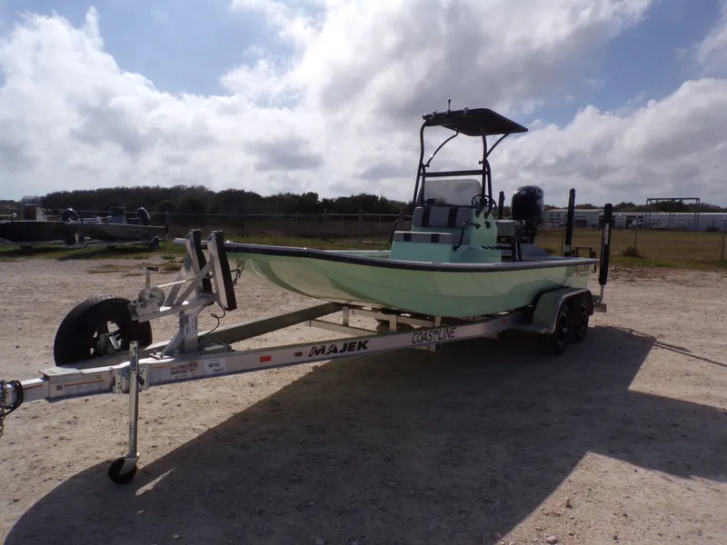 Slide: The Image of 2026 Majek 21 Redfish boat on trailer outdoors. - 11