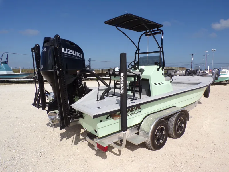 Slide: The Image of 2026 Majek 21 Redfish boat with Suzuki engine on trailer. - 14