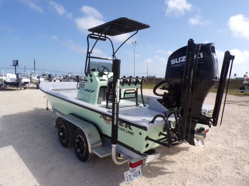 Slide: The Image of Majek 21 Redfish 2026 boat with Suzuki engine on trailer. - 16