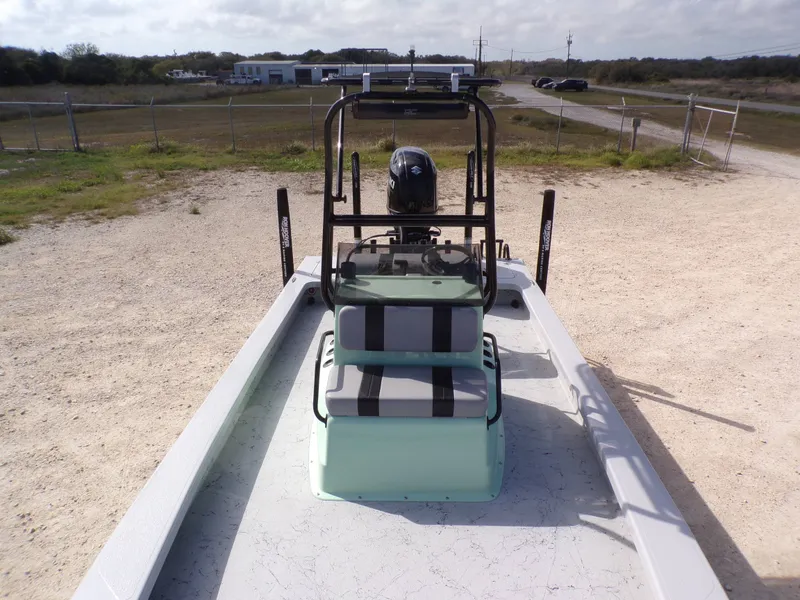 Slide: The Image of 2026 Majek 21 Redfish boat parked on gravel path. - 18