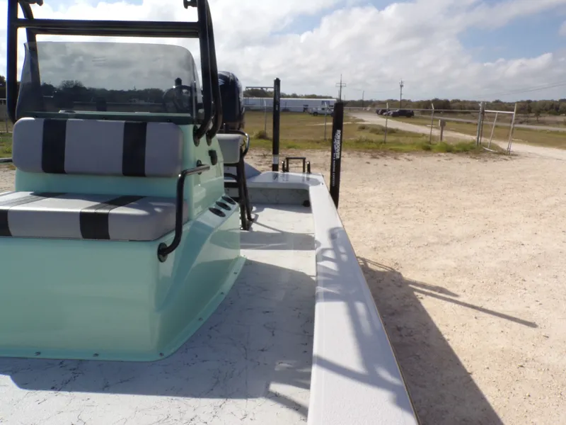 Slide: The Image of 2026 Majek 21 Redfish boat parked on dry land. - 20