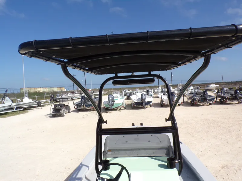 Slide: The Image of Majek 21 Redfish 2026 boat with canopy in parking lot. - 22