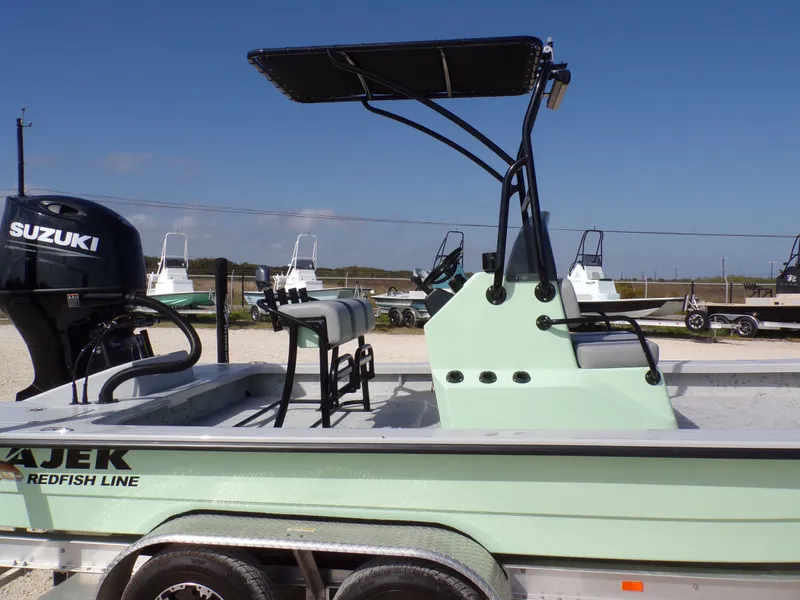 Slide: The Image of 2026 Majek 21 Redfish boat with Suzuki engine, side view. - 29