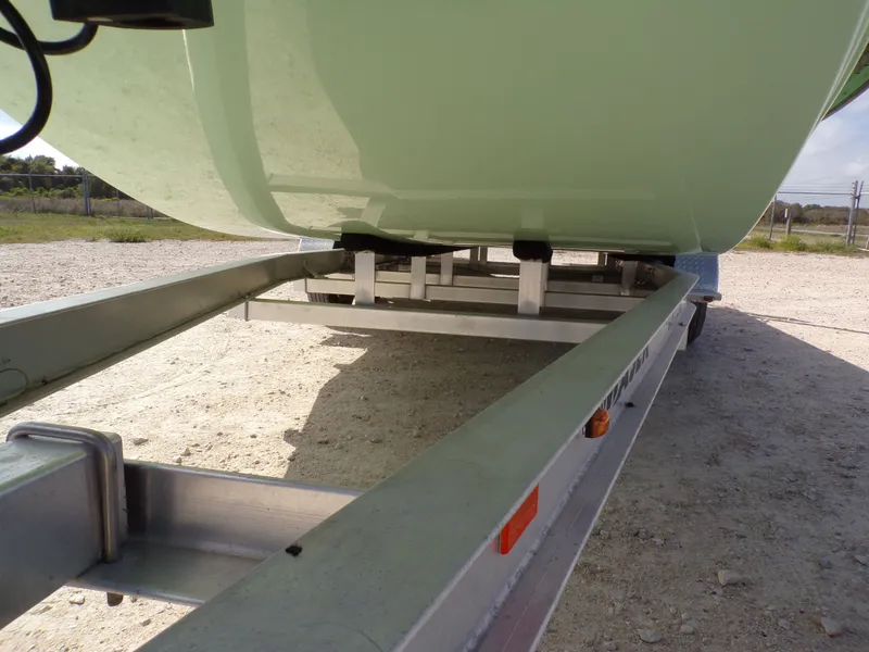 Slide: The Image of 2026 Majek 21 Redfish boat on trailer parked outdoors. - 3