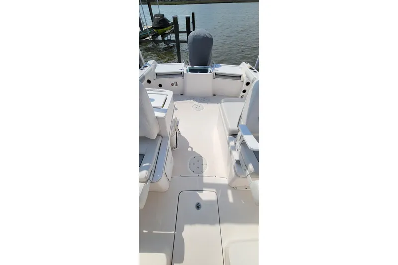 Slide: The Image of Interior view of a 2013 Everglades 230 Dual Console boat, featuring a speaker system. - 12