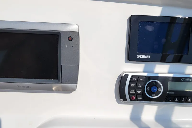 Slide: The Image of Steering console of 2013 Everglades 230 Dual Console boat with Garmin navigation system. - 7