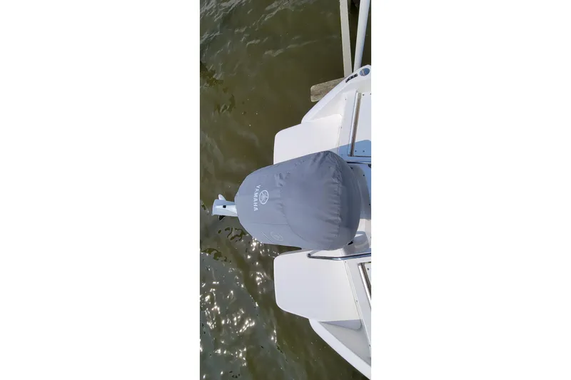 Slide: The Image of Dashboard of a 2013 Everglades 230 Dual Console with Garmin, Yamaha, and Jensen displays. - 8