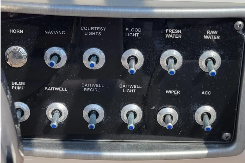 Slide: The Image of 2013 Everglades 230 Dual Console boat with Yamaha engine cover on water. - 9