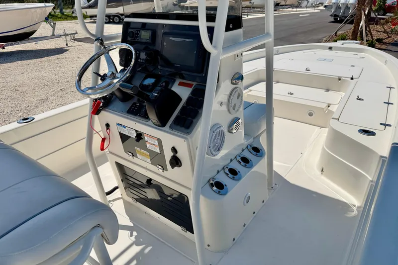 Slide: The Image of 2008 ShearWater 2400Z boat console with steering wheel and navigation equipment. - 12