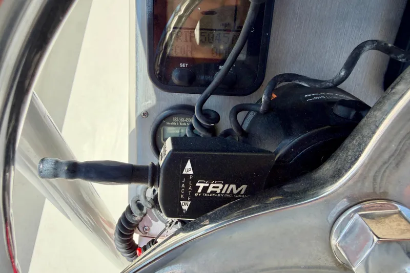Slide: The Image of Close-up of a 2008 ShearWater 2400Z boat control panel with Pro Trim switch. - 17