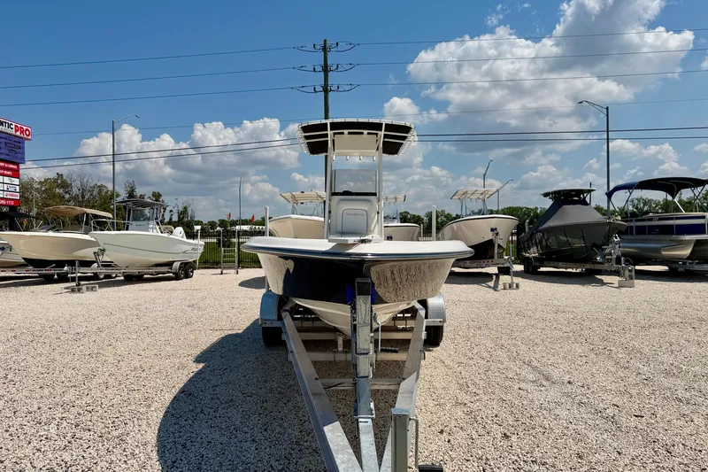 Slide: The Image of 2008 ShearWater 2400Z boat on trailer in sunny outdoor showroom. - 2