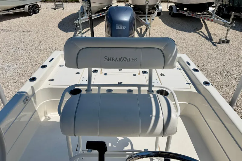 Slide: The Image of 2008 ShearWater 2400Z boat interior with seating and Yamaha 250 engine. - 21