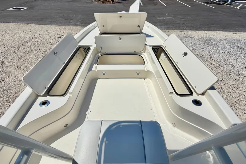 Slide: The Image of 2008 ShearWater 2400Z boat with open storage compartments on deck. - 23