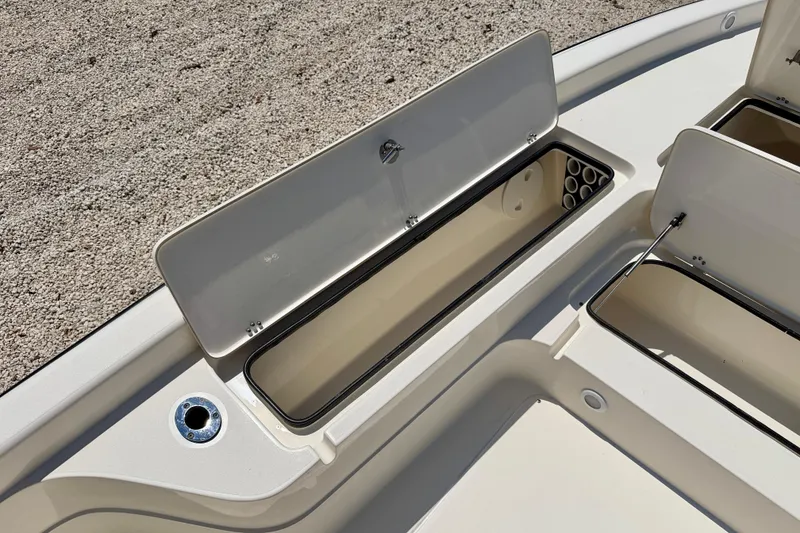 Slide: The Image of Open storage compartments on a 2008 ShearWater 2400Z boat, showcasing ample space. - 25