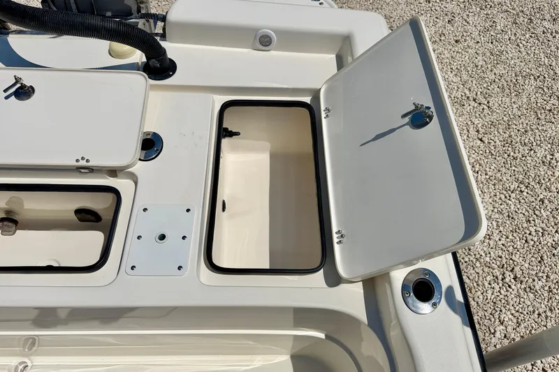 Slide: The Image of Open storage compartments on a 2008 ShearWater 2400Z boat, showcasing interior design. - 29