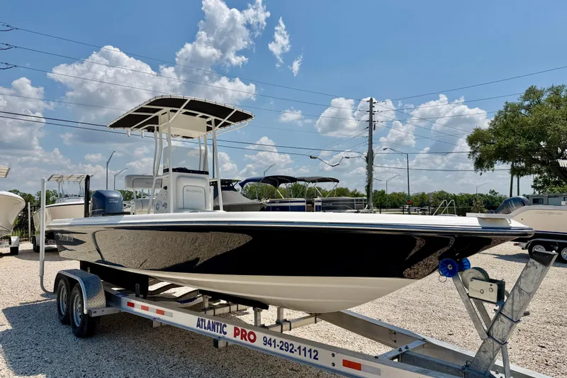 Slide: The Image of 2008 ShearWater 2400Z boat on trailer under clear blue sky. - 3