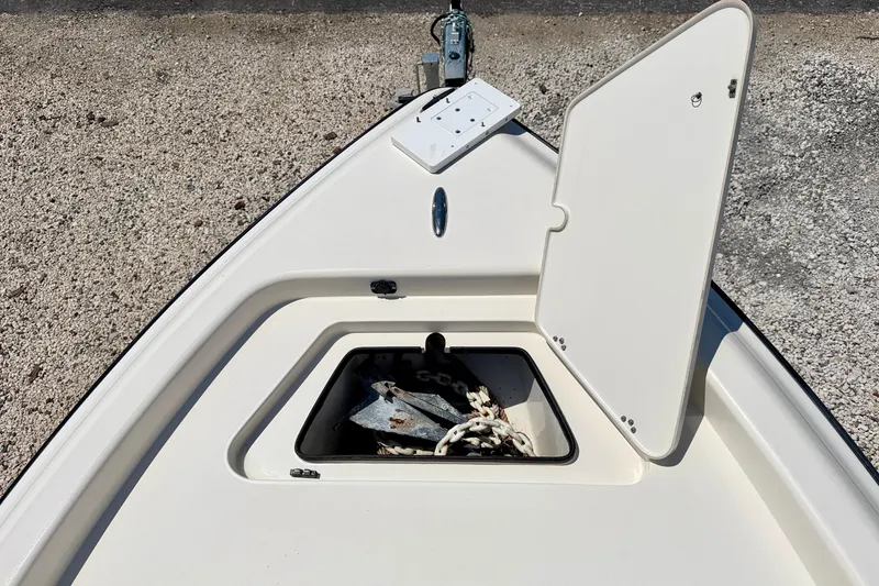 Slide: The Image of Bow of 2008 ShearWater 2400Z boat with open anchor compartment. - 30