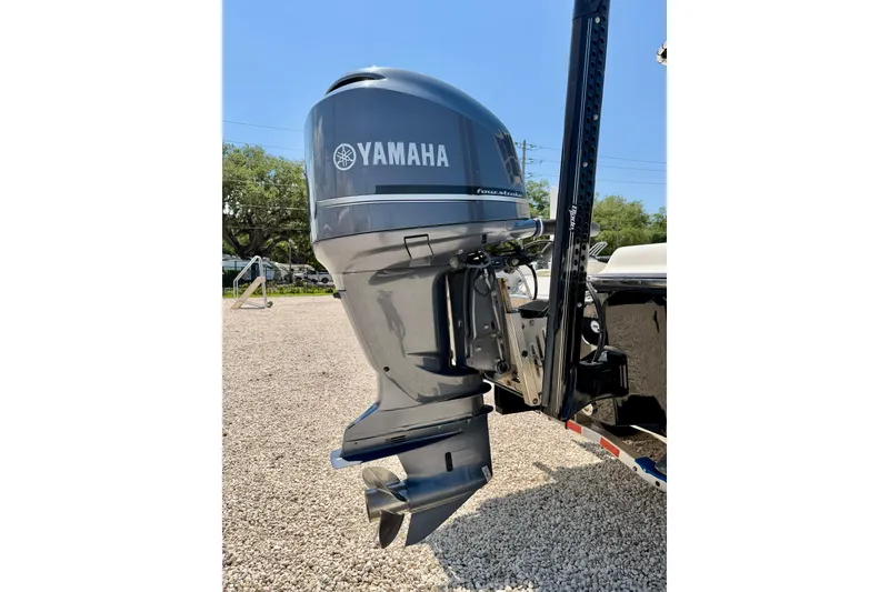 Slide: The Image of Yamaha outboard motor on 2008 ShearWater 2400Z boat, parked on gravel. - 36