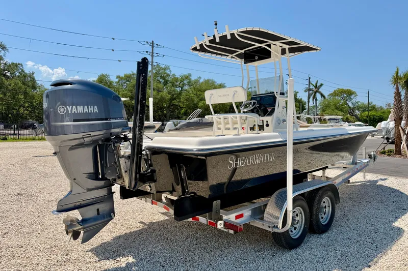 Slide: The Image of 2008 ShearWater 2400Z boat with Yamaha engine on trailer, parked outdoors. - 5