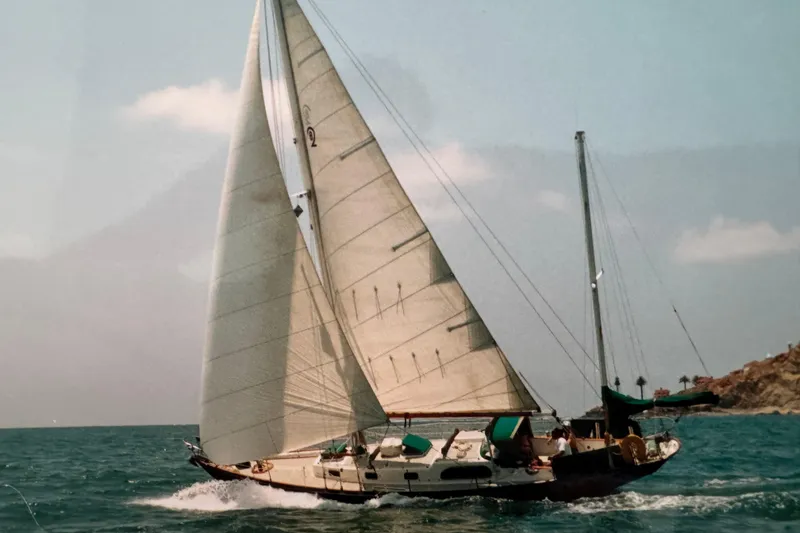 Slide: The Image of 1960 Rhoads Bounty sailboat navigating ocean waters under full sail. - 3