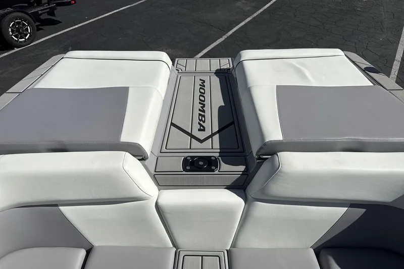 Slide: The Image of 2025 Moomba Craz boat interior with sleek gray and white seating design. - 19