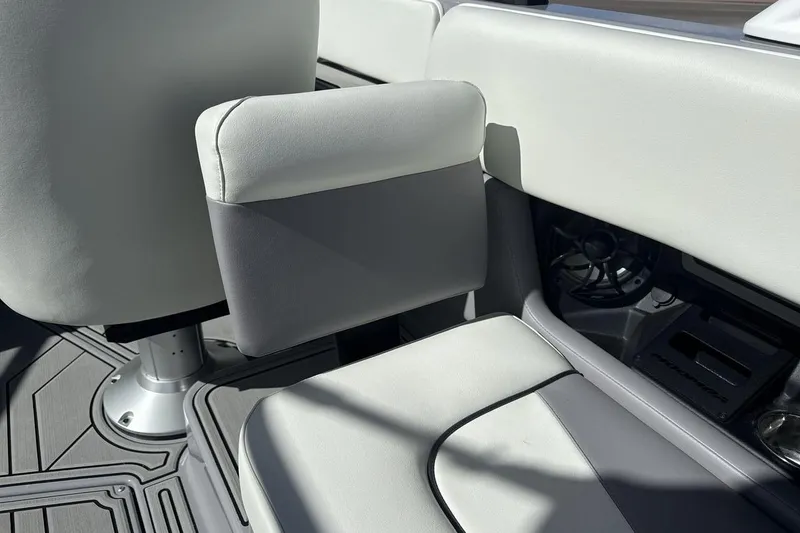 Slide: The Image of 2025 Moomba Craz boat interior with white and gray seating and speaker system. - 23