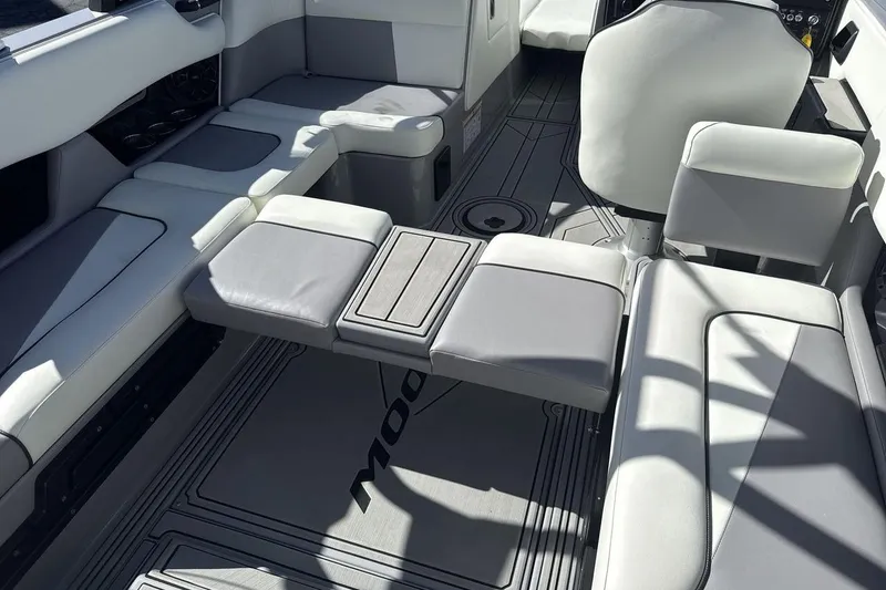 Slide: The Image of 2025 Moomba Craz boat interior with gray seating and modern design. - 24