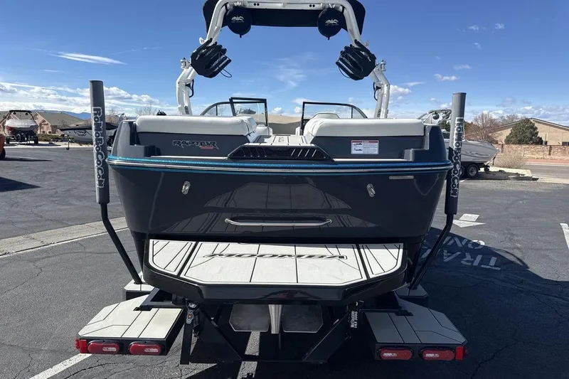 Slide: The Image of 2025 Moomba Craz boat rear view, featuring Raptor engine and swim platform. - 4